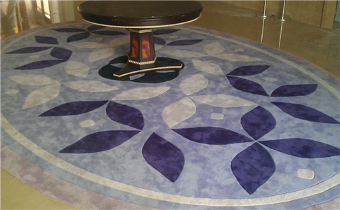 手工地毯按原材料分为几类？